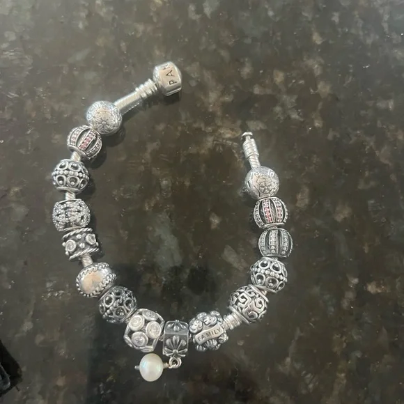 Pandora bracelet with 15 rare charms and sterling silver bracelet. - Picture 2 of 2